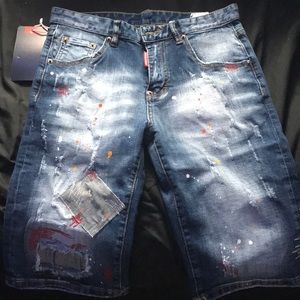 Jean shorts with paint splatter